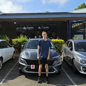 a person standing next to a car